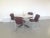 This set of four dining chairs have been designed in a Space Age style and feature new upholstery. The design is possibly...