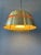 Orange Mid-Century pendant lamp by Lakro Amstelveen. The lamp is made out of steel and has an orange lacquer from the...