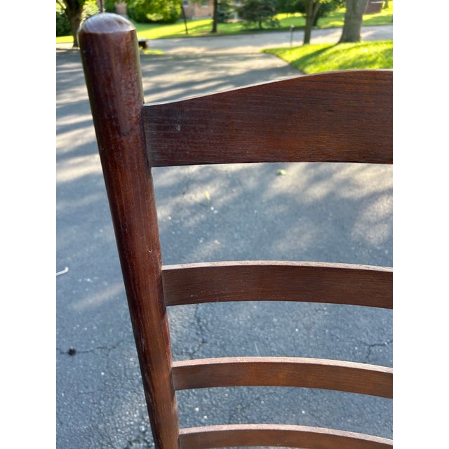 Beautiful set of dark wood and rush seat ladder back chair. These are in great vintage condition and are sturdy. The seat...