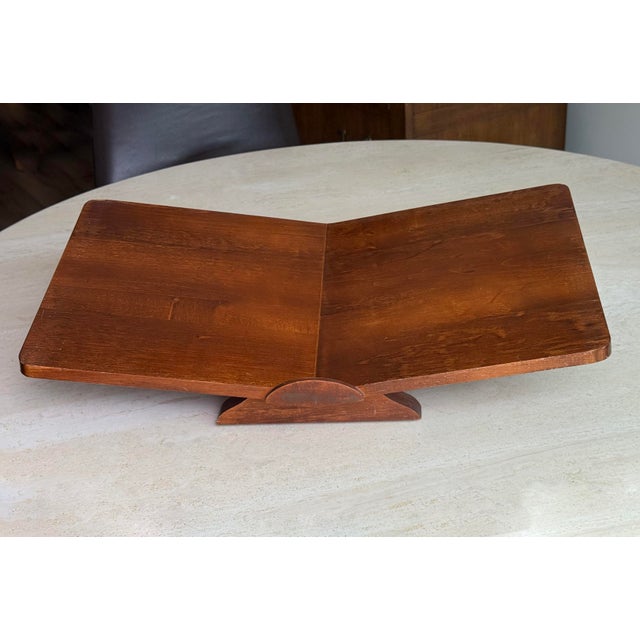 This handmade bookstand combines walnut wood with bold lines and a subtle forward tilt.
