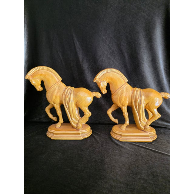 vintage Mid-Century modern ceramic horse sculptures. Glazed in a rich, high-gloss mustard yellow/caramel ochre, these...