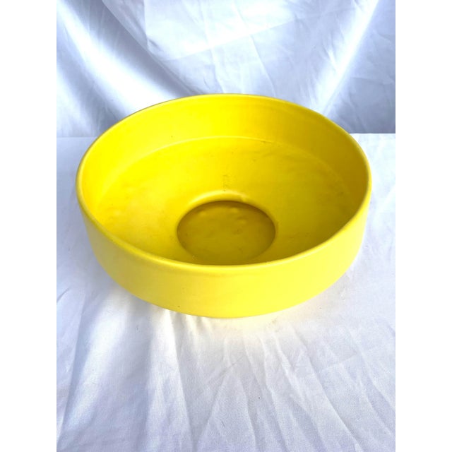 Fun foot bright yellow vintage bowl. This is by Heager ceramics popular mid century company.