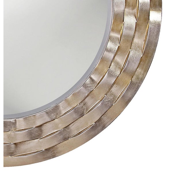 The Cartier Mirror features a round frame that is characterized by rows of wavy bars. The ripple effect that it creates...