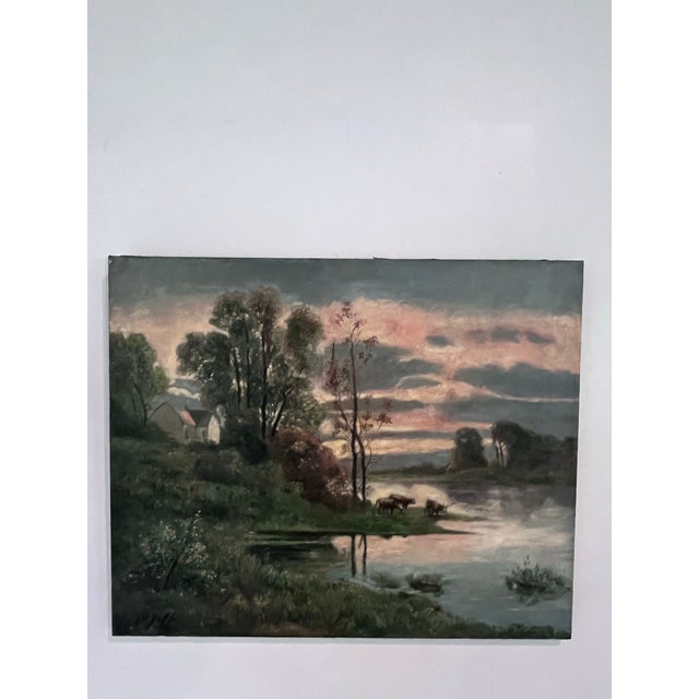 A serene vintage oil on canvas depicting a peaceful riverside landscape at dusk. Rendered in a soft tonalist palette, this...