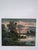A serene vintage oil on canvas depicting a peaceful riverside landscape at dusk. Rendered in a soft tonalist palette, this...
