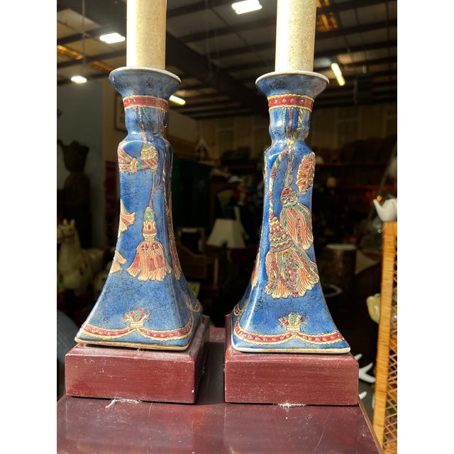 Up for consideration is a beautiful vintage pair of ceramic and wooden table lamps with tassel accents. These would look...