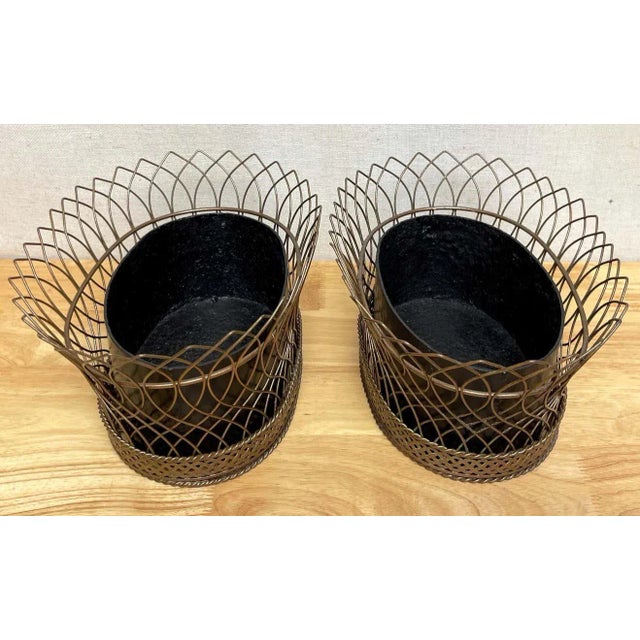 Pair of antique French gilt tôle & iron tole metal filigree oval planters France, circa 1900s Each one of oval basket...