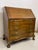 Carved in the Georgian manner about 1940, a mahogany secretary desk has secret compartments and cubicles inside.The...