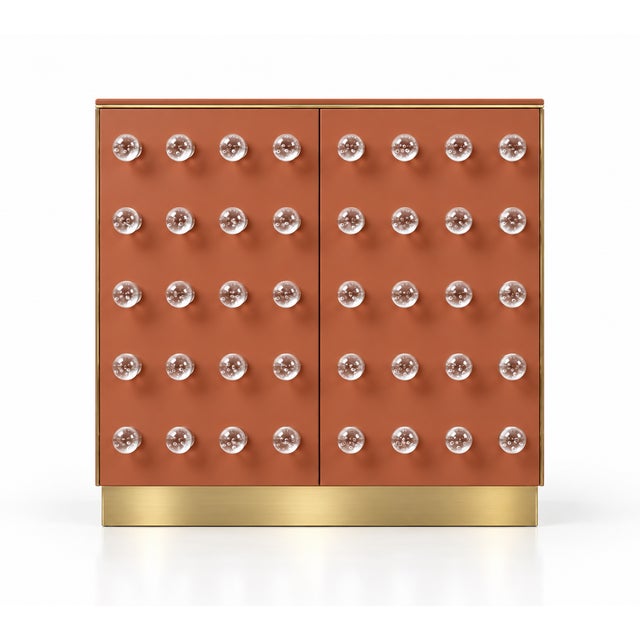 Terracotta murano glass lends this italian sculptural cabinet a warm, expressive colour. Ninety rounded glass elements...
