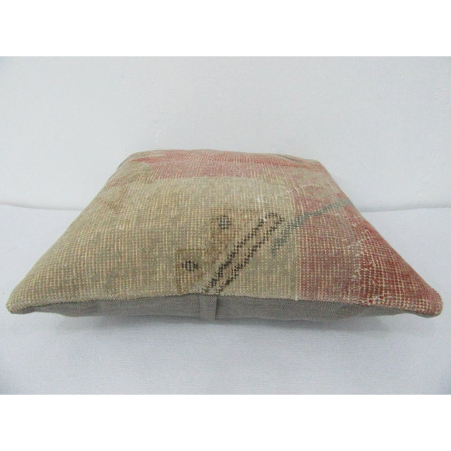 This is a pillow cover made from a vintage kilim rug. The piece was properly washed and ready to use. Pillow inserts not...