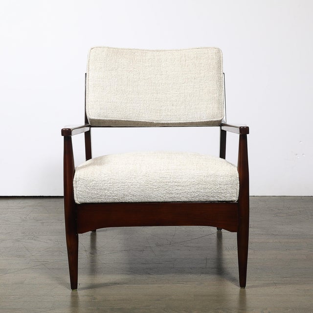 This pair of Mid-Century Modernist sculptural armchairs, crafted in America circa 1960, beautifully exemplifies the...