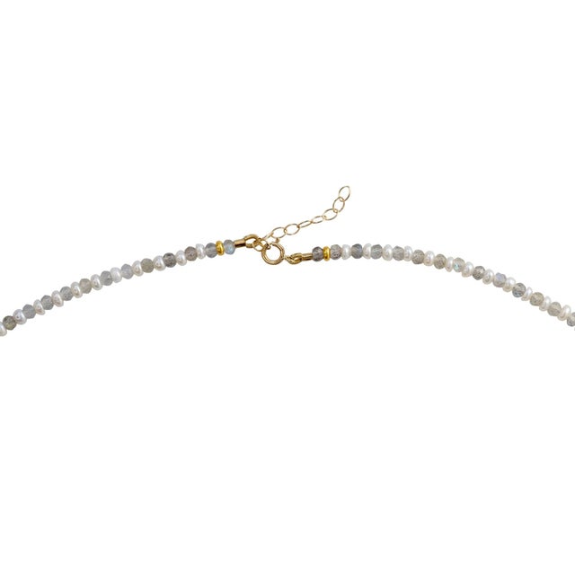 A whisper of light and shadow — the Lustra Necklace captures the poetry of contrast. Tiny freshwater pearls glow with...