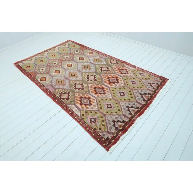 This beautiful, vintage, handwoven kilim is approximately 60 years old. It is handmade, of very fine quality hand spun...