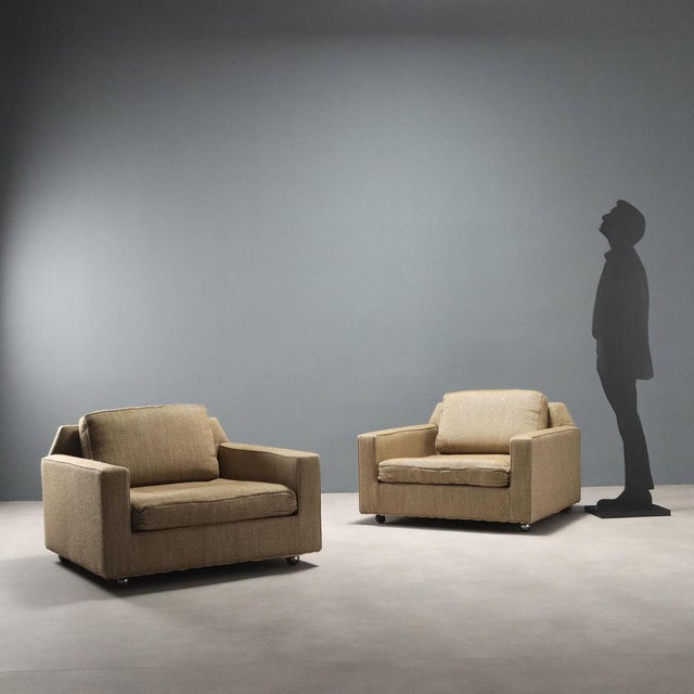 Pair of large-sized vintage armchairs of Italian manufacture from the 20th century with original beige fabric upholstery...