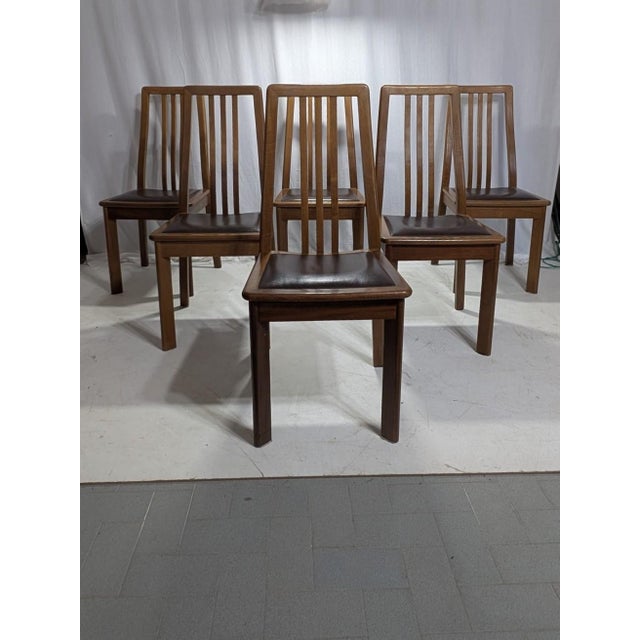 Introducing a set of 6 dining chairs that embody the sophistication of Italian design. Produced by renowned Italian...