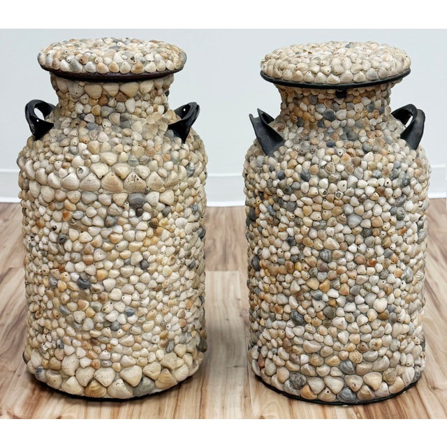 Large pair of coastal vibe shell encrusted antique milk jugs. Metal milk jug frames are completely covered in sea shells...