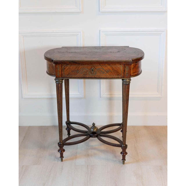 This refined Napoleon III side table, dating to around 1870, embodies the elegance and craftsmanship of 19th-century...