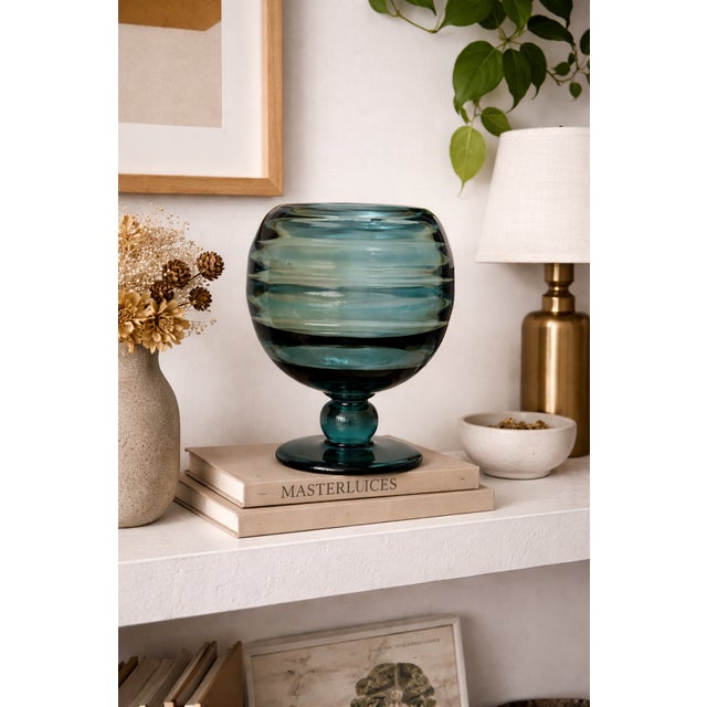 A striking piece of mid-century scandinavian art glass, this sculptural pedestal vase is attributed to swedish designer...