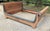 Elegant mid-1950s daybed in natural rattan decorated with blue and black nets and diamonds. Very good general condition.....