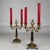 An elegant pair of 19th-century French candelabra, finely crafted in brass and distinguished by their contrasting ebony...