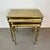 Elegant mid-century neoclassical set of three nesting tables crafted in gilt brass, featuring slender fluted legs and...