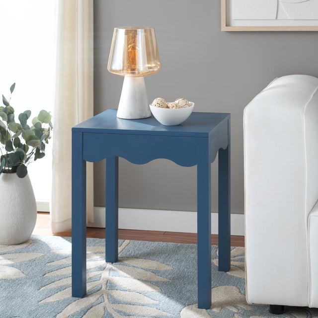 Introduce a touch of sophistication with the Lilith Square Wave Accent Table in a calming blue color. This table features...