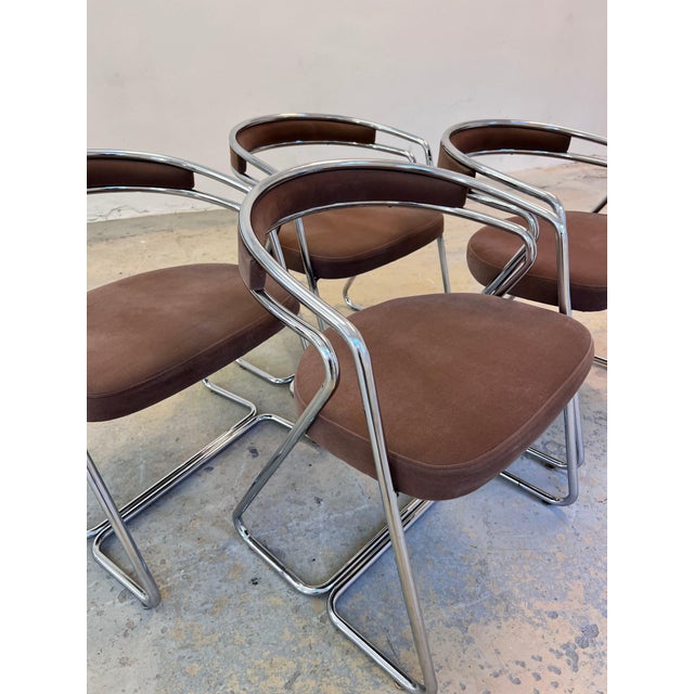 This set of four Italian upholstered chairs from the 1970s makes a glamorous statement in the dining room and perfectly...