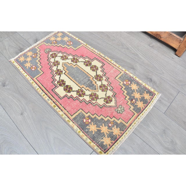 This is a vintage Turkish Oushak rug from the 1960s. The piece was hand-knotted.