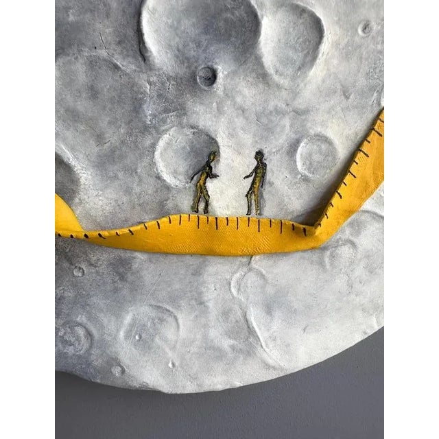 Foam clay, acrylic and enamel on fir wood circular relief that combines lunar bas-relief with a measured, stitched yellow...