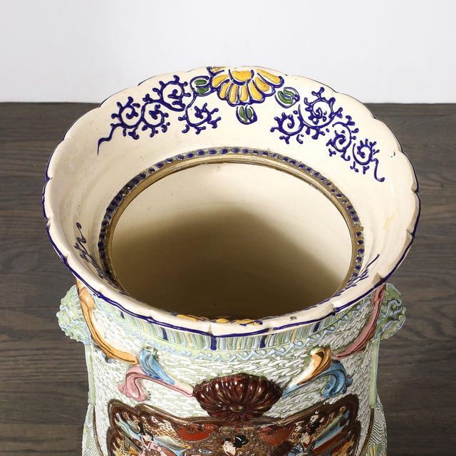 This ornate Large Japanese Satsuma Bead-Design Ceramic Umbrella Stand originated in Japan, 20th Century. The piece...