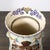 This ornate Large Japanese Satsuma Bead-Design Ceramic Umbrella Stand originated in Japan, 20th Century. The piece...