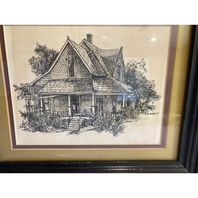 A vintage framed architectural illustration dated 1974, featuring a finely detailed pen-and-ink drawing of a classic home....