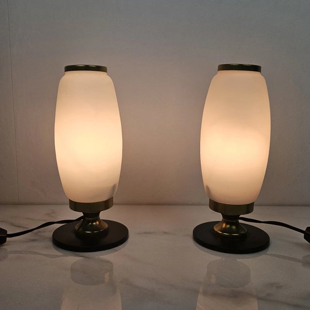 Very cute set of 2 small opaline glass table or bedside lights. This set if fabricated in Italy in the 1950's. They are...