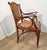 Pair of bentwood chairs with armrests; the seat and backrest are padded and upholstered in fabric. Produced by Jacob &...