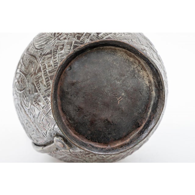 Highly decorative with etched all over decoration. Standing on a circular footring with a bottle form body and applied...