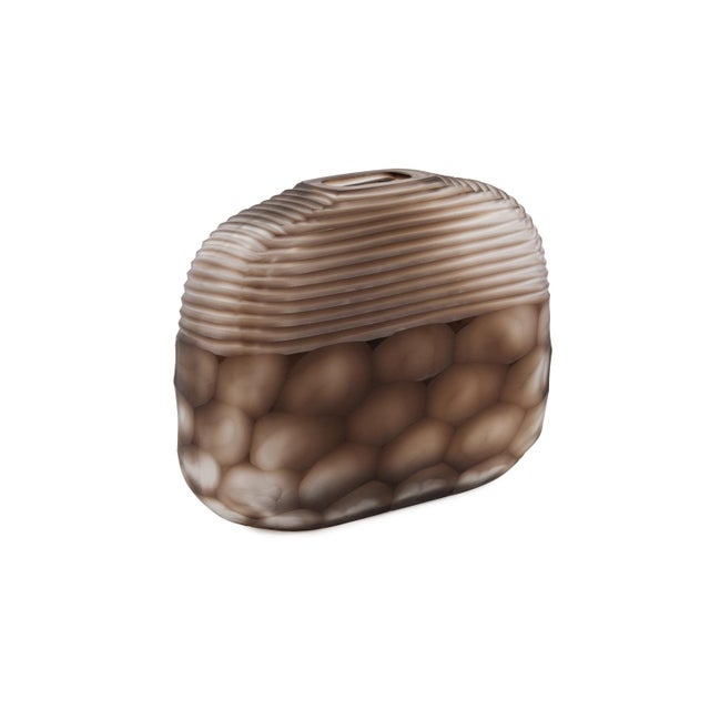 The cut patterns and the use of frosted and translucent techniques gives the Bruni short vase it's uniqueness. The deep...