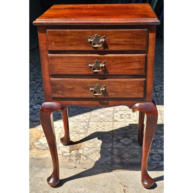 A Mid 20th Century Queen Anne Style Mahogany Side Table / Nightstand Measures 19" in width, 16" in depth and 29" in height.