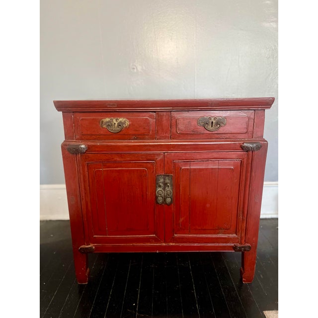 Rich in color and restrained in form, this late Qing Dynasty red lacquer cabinet exemplifies the quiet elegance of...