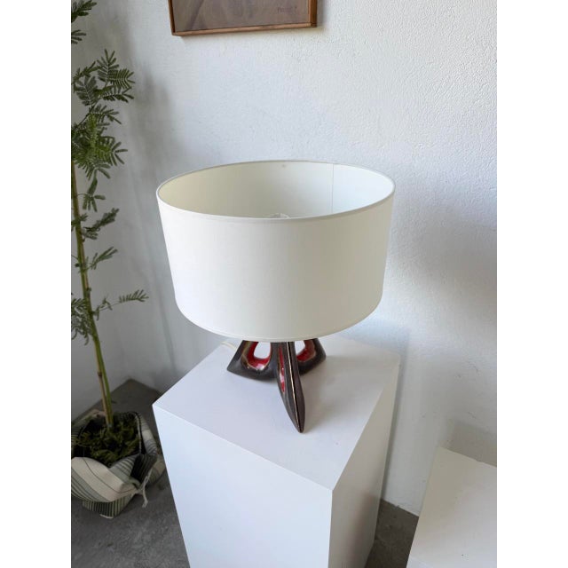 Old free-form ceramic table lamp - in the shape of a triangle with holes in its center - from the 1950s. we love this...