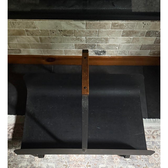 Equally at home beside a fireplace or sofa, this vintage blackened iron carrier offers stylish storage for firewood,...