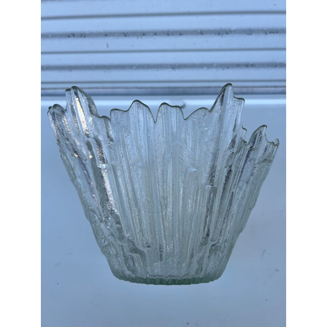 Beautiful striking Heavy glass bowl. Looks like icicles. Great bowl when celebrating the northern lights. Fill with ice,...