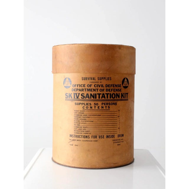 This is a vintage Cold War era Survival Kit box dated 1962. The hardboard box features a tin base and fitted hardboard...