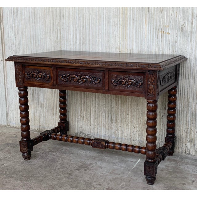 Handsome oak library piece that can be used as a desk or work table. Made of oak having carved gadrooned edges. A...