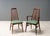 Denmark, ca. 1960s. A set of eight rosewood Eva dining chairs by Niels Koefoed for Koefoeds Hornslet. Each features a...