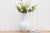 Featuring a modern shape with an elegant long neck this tall off-white glazed jar is an impressive container for flowers...