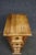 Southwestern-style tall chest of drawers crafted from solid pine, with a warm honey-toned finish and substantial paneled...