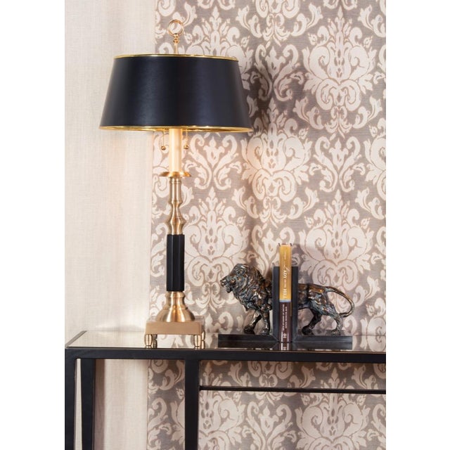 Illuminate your study with this traditional hand finished cast brass candlestick lamp. This classic table lamp features...
