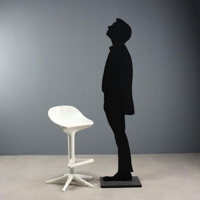 Stool with footrest and adjustable height, made of metal and plastic material. This piece is attributed to the mentioned...