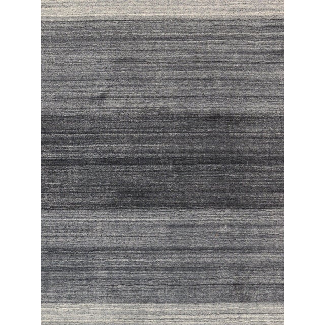 The tribal motifs of this traditional area rug collection reflect the soft pile and unparalleled elegance of classic...
