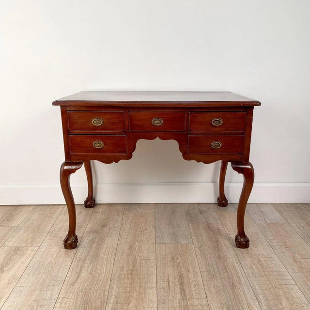A Chippendale style walnut lowboy, 19th century, American.